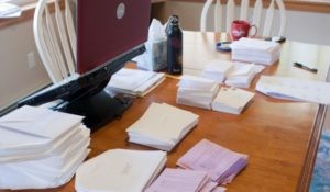 Picture of a lot of envelopes on the table.
